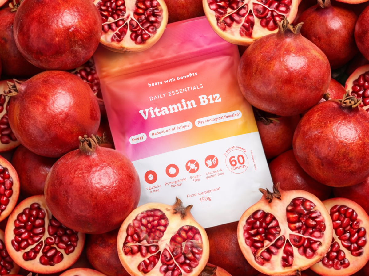 Vitamin B12 pouch arranged among pomegranates.
