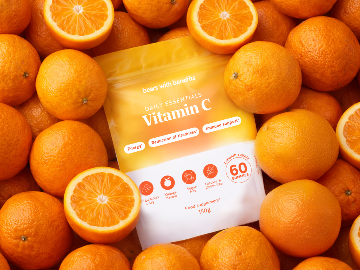Vitamin C pouch arranged among oranges.
