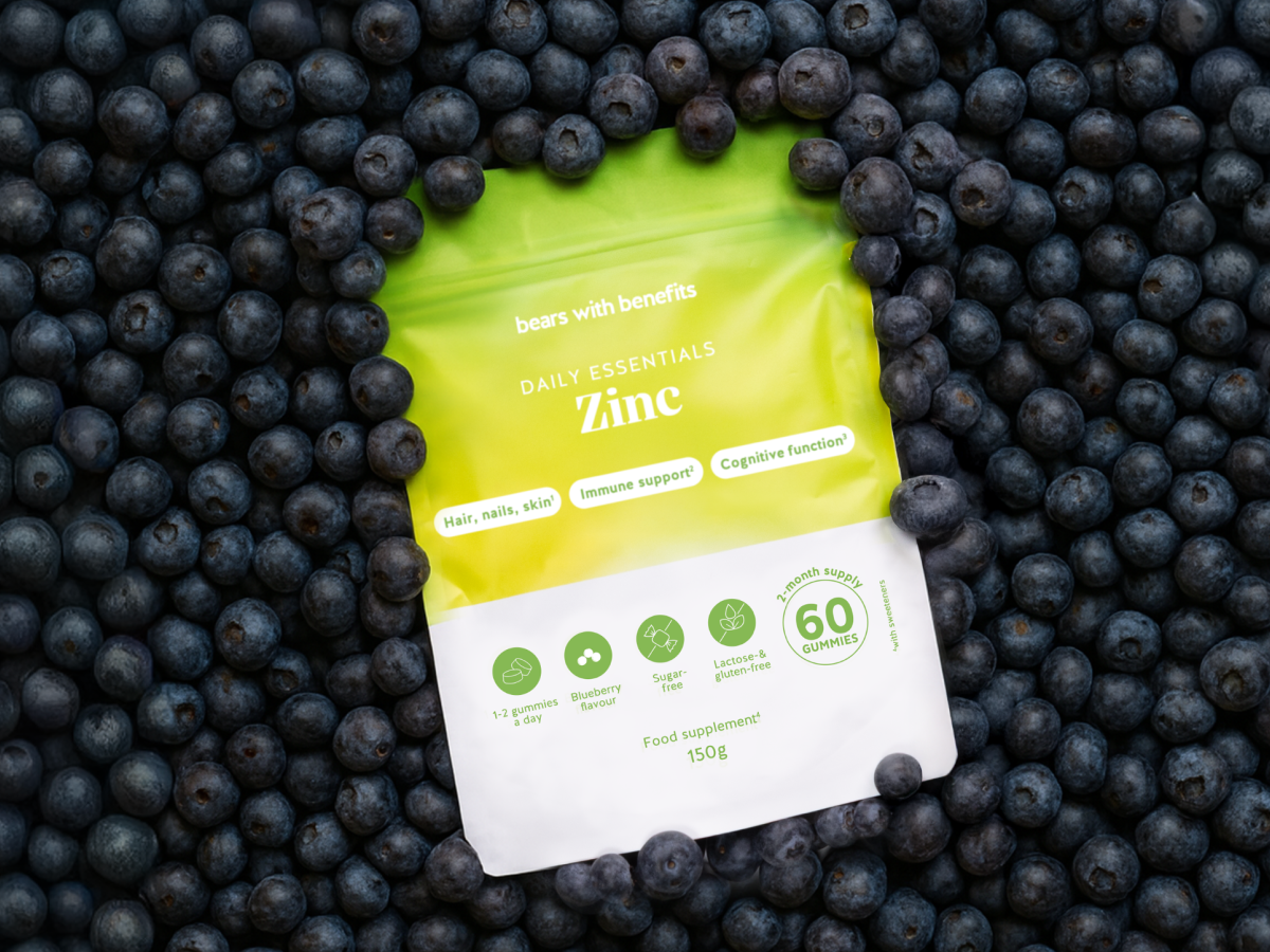 Zinc pouch arranged among lemons and limes.